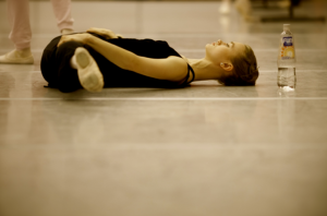 dancer stretching floor